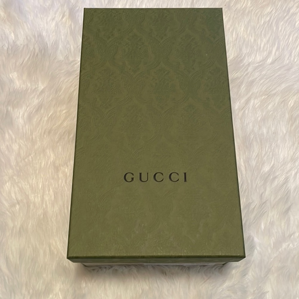 - Green GUCCI box with tissue paper